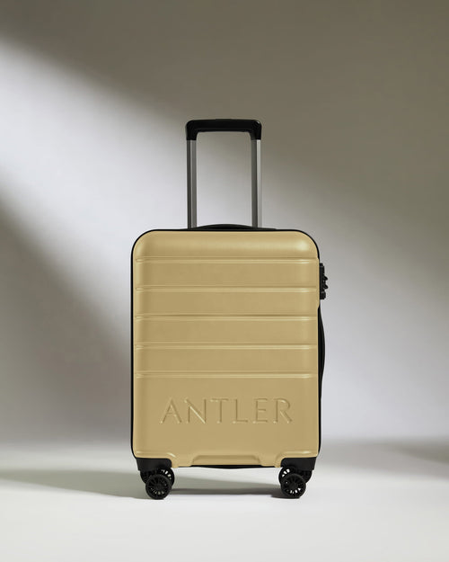 Cabin Suitcase in Dark Sand - Logo