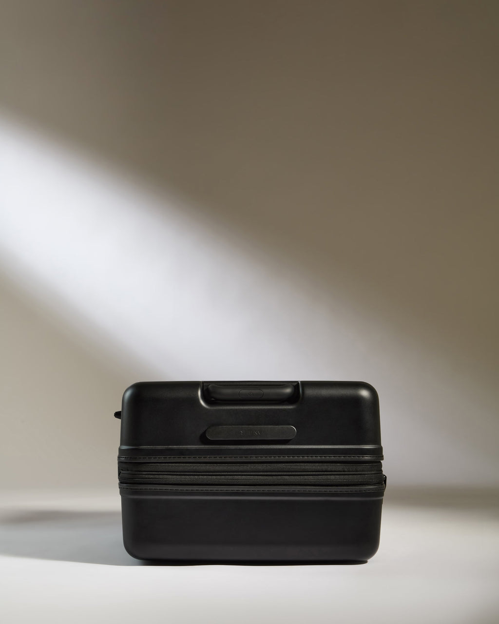 Large Suitcase in Black - Icon Stripe