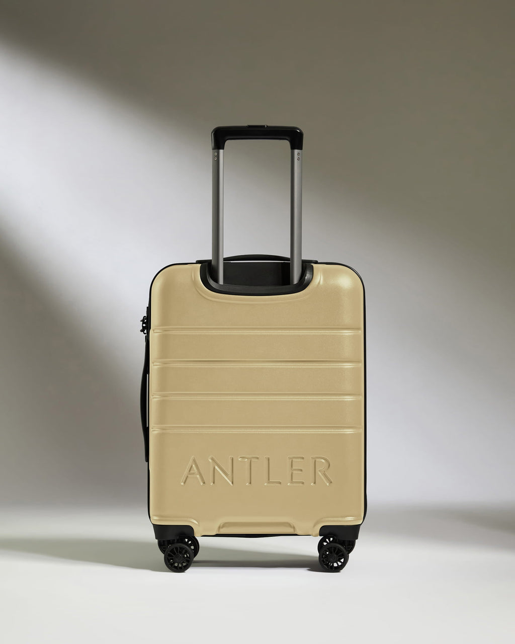 Cabin Suitcase in Dark Sand - Logo