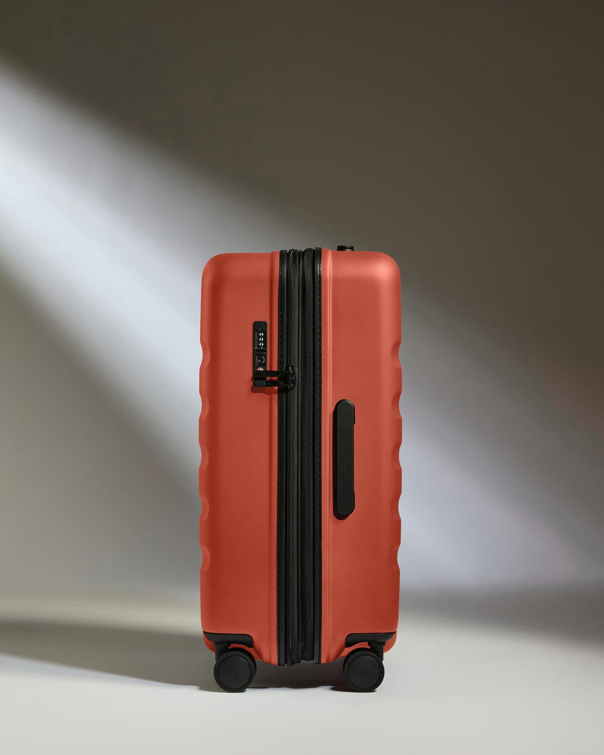 Medium Suitcase in Buckthorn Red - Icon Stripe